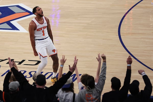 New York Knicks' Cameron Payne (1) celebrates with fans after a 3-point basket during the first half of an NBA basketball game against the Atlanta Hawks, Monday, Jan. 20, 2025, in New York. (AP Photo/Heather Khalifa)