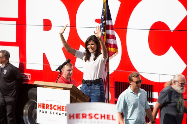 Former U.N. Ambassador Nikki Haley campaigns in November with then-Republican U.S. Senate candidate Herschel Walker. She did similear work in 2020, when she was one of the earliest big-name GOP supporters of then-U.S. Sen. Kelly Loeffler amid her tough challenge from fellow Republican Doug Collins. (Christina Matacotta for The Atlanta Journal-Constitution)