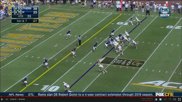 At the snap, Jackson is coming right up the gap between center Freddie Burden and right guard Shaquille Mason. Georgia Southern caught Tech here – Burden engaged nose tackle Jay Ellison and left guard Trey Braun and left tackle double teamed end Quaun Daniels. Jackson has a free run at Thomas. Hill remains practically stationary. The linebackers (on the left side is actually an end, Bernard Dawson; the other is Antwione Williams) seem to be reading Thomas before reacting.