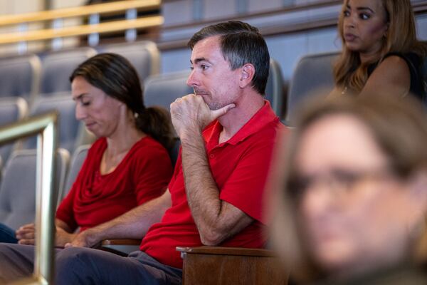 Republican Jason Frazier watches the public comment portion of the Fulton County Board of Commissioners meeting in Atlanta on Wednesday, June 7, 2023. The board is voting on whether to make Frazier, who has challenged the registrations of 10,000 voters, a member of the county elections board. (Arvin Temkar / arvin.temkar@ajc.com)