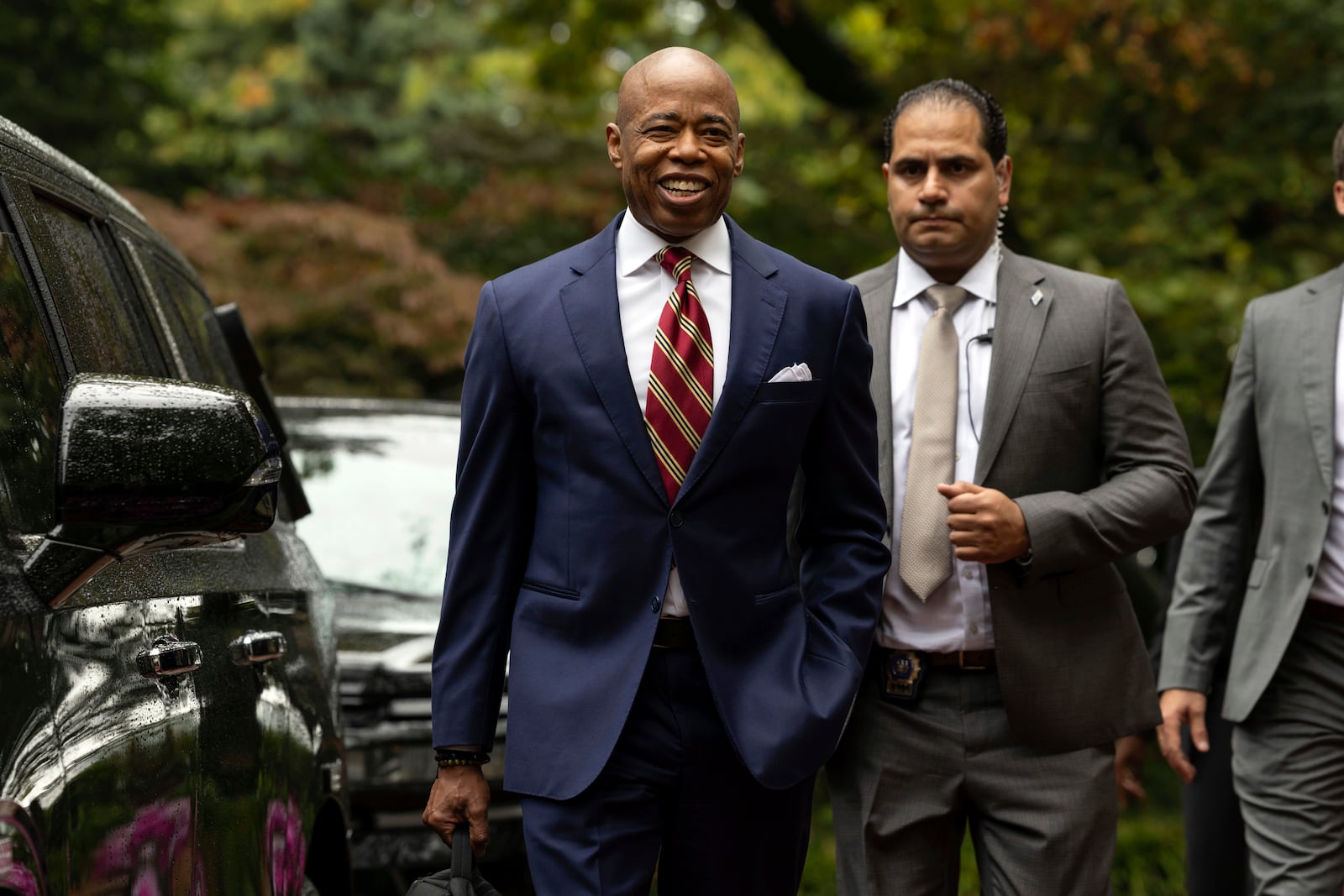 New York City Mayor Eric Adams, left, exits Gracie Mansion, the official residence of the mayor, Thursday, Sept. 26, 2024, in New York. (AP Photo/Yuki Iwamura)