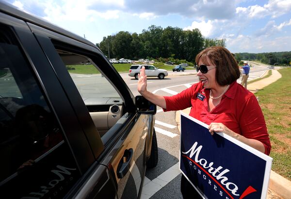 Martha Zoller, a Republican congressional candidate for Georgia's 9th District, campaigns across from the World Language Academy at Chestnut Mountain during runoffs for the primary election in Flowery Branch, Ga., on Tuesday Aug. 21, 2012.