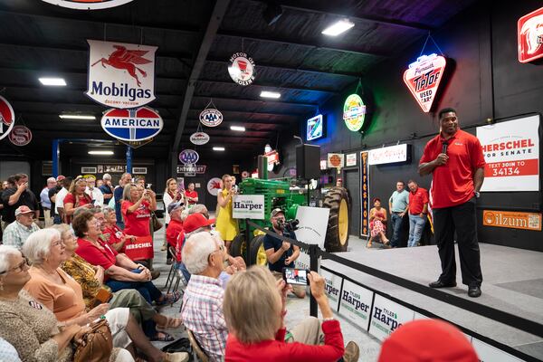 Republican U.S. Senate candidate Herschel Walker speaks at a campaign rally Tuesday at a car dealership in Ocilla. Walker earlier this month appeared at events closed to the media, but this past week he spoke with reporters. (Nicole Craine/The New York Times)..