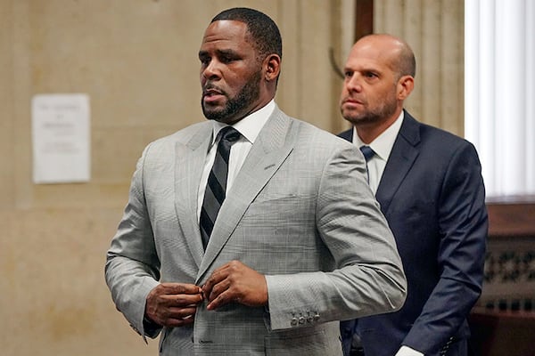 In this June 6, 2019, file photo, singer R. Kelly pleaded not guilty to 11 additional sex-related felonies during a court hearing before Judge Lawrence Flood at Leighton Criminal Court Building in Chicago.