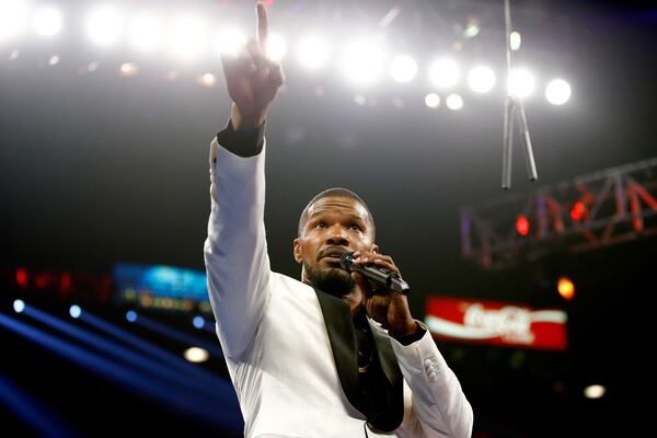 LAS VEGAS, NV - MAY 02: Jamie Foxx sings the national anthem of the United States of America before the welterweight unification championship bout between Floyd Mayweather Jr. and Manny Pacquiao on May 2, 2015 at MGM Grand Garden Arena in Las Vegas, Nevada. (Photo by Al Bello/Getty Images) LAS VEGAS, NV - MAY 02: Jamie Foxx sings the national anthem of the United States of America before the welterweight unification championship bout between Floyd Mayweather Jr. and Manny Pacquiao on May 2, 2015 at MGM Grand Garden Arena in Las Vegas, Nevada. (Photo by Al Bello/Getty Images)