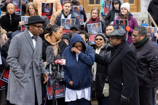 Lois Taylor, mother of Cornelius Taylor, becomes emotional during a protest in front of City Hall in Atlanta on Thursday, January 23, 2025. Cornelius Taylor was killed when the city cleared the encampment he lived in last week. (Arvin Temkar / AJC)