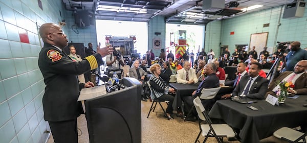 March 31, 2023 Atlanta: Atlanta Fire Chief Rod Smith (left) speaks during Friday’s event. The Atlanta Fire Rescue Department honored the first African American men and women firefighters hired by the City of Atlanta on the 60th anniversary of the AFRD’s integration on April 1, 1963, and in 1977, respectively. The event was held at fire station 16 located at 1048 Joseph E. Boone BLVD. NW in Atlanta. The first African American firefighters and their representatives in attendance were presented with a sentimental gift for their contributions. (John Spink / John.Spink@ajc.com)

