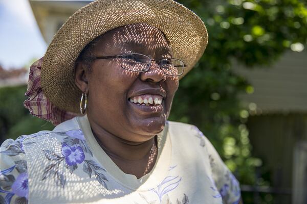 Sandra Gordon smiles for a portrait at her home in Atlanta’s Old Fourth Ward community. “I’d hate to move,” said Gordon. “But if I have to, I have to.” (ALYSSA POINTER/ALYSSA.POINTER@AJC.COM)