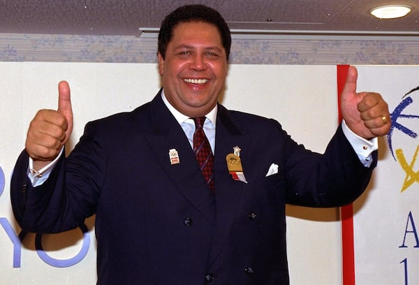 Atlanta Mayor Maynard Jackson gives thumbs-up signs during a news conference at a Tokyo hotel Tuesday, Sept. 18, 1990 after Atlanta won a bid to host the 1996 Centennial Olympic Games.