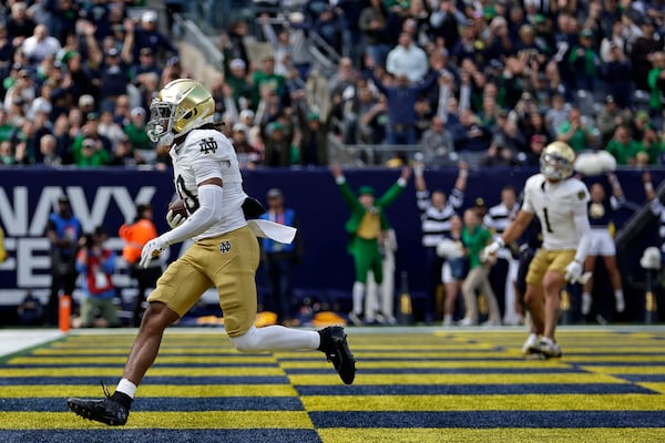 Notre Dame wide receiver Kris Mitchell (10) reacts after scoring a touchdown during the first half of an NCAA college football game against Navy Saturday, Oct. 26, 2024, in East Rutherford, N.J. (AP Photo/Adam Hunger)