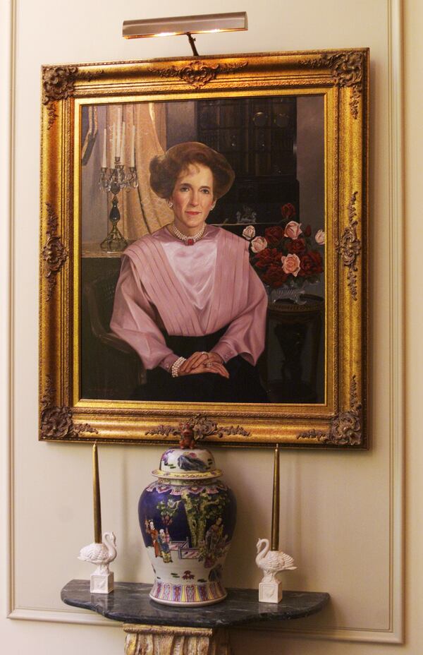 A portrait of Emilie Spivey hangs across the lobby from a portrait of her husband in Spivey Hall at Clayton State University in Morrow. (PHIL SKINNER/AJC staff)