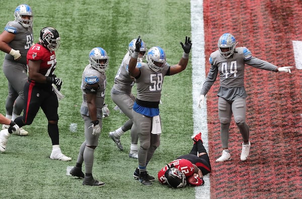 Detroit Lions linebacker Jamie Collins signals touchdown as Falcons running back Todd Gurley tries to stop short of the end zone to control the final minutes of the clock in the fourth quarter of an NFL football game on Sunday, Oct 25, 2020 in Atlanta. Gurley broke the plane for a touchdown for a 20-16 lead and the Falcons added the 2-point conversion to extend the lead to 22-16 but left enough time on the clock for the Lions to come back for the game winning touchdown and extra point to beat the Falcons 23-22 as time expired. (Curtis Compton/Atlanta Journal-Constitution/TNS)