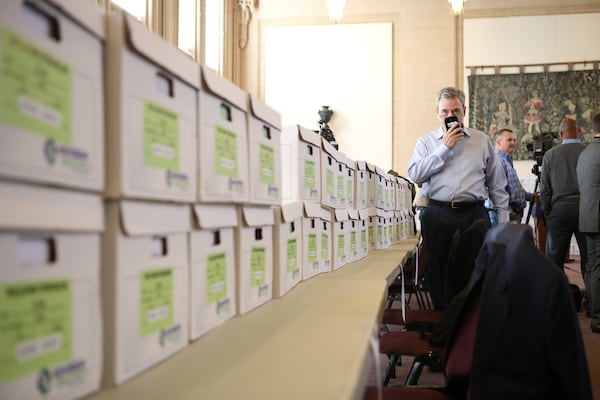 Boxes line the Old Council Chamber in Atlanta City Hall. The boxes held 1.4 million documents related to the City Hall bribery investigation. Reed said at a press conference that the city was providing “every document we’ve provided to the Justice Department thus far in this matter.” But the Reed administration withheld a subpoena that showed the investigation had reached deeply into the airport and city’s Watershed Department. HENRY TAYLOR / HENRY.TAYLOR@AJC.COM