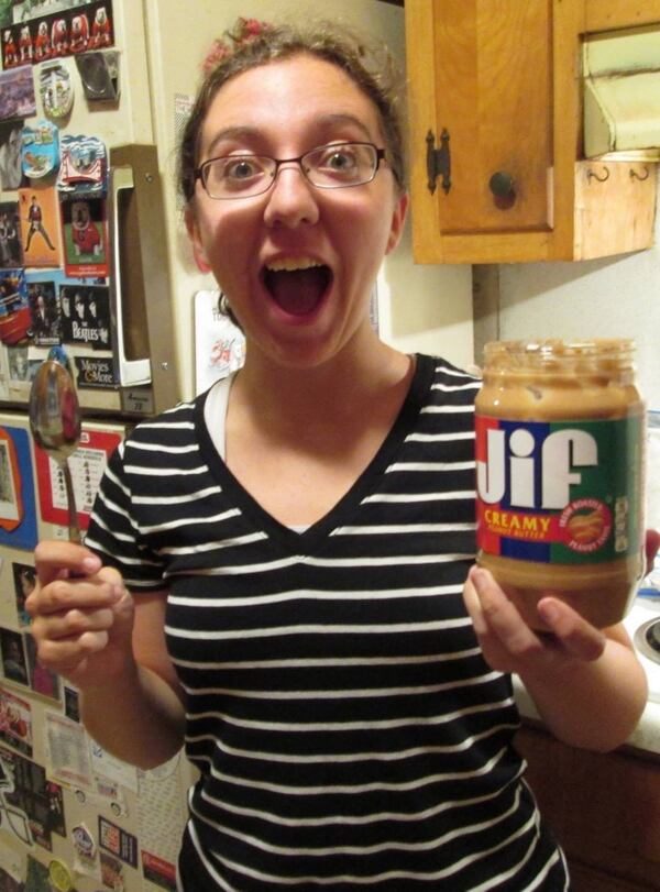 Olivia King enjoys her first taste of peanut butter after two months in Europe, where it’s not as easy to find. CONTRIBUTED BY BILL KING / SPECIAL