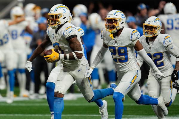 Los Angeles Chargers safety Derwin James Jr. (3) celebrates after an interception during the second half of an NFL football game against the Atlanta Falcons on Sunday, Dec. 1, 2024 in Atlanta. (AP Photo/Mike Stewart)