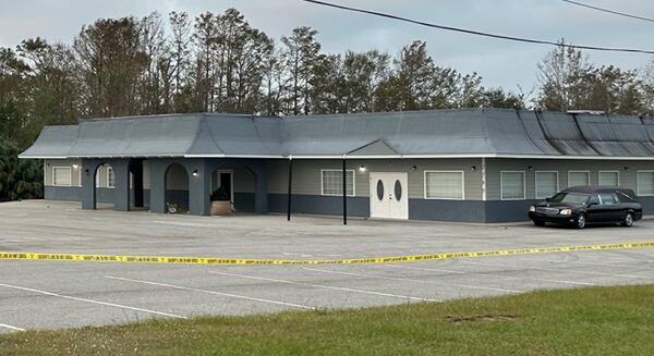 Crime tape surrounded Johnson Funeral Home in Coffee County on Monday. Kristen Kitchens / Special to the AJC