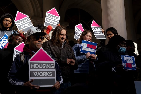 People gather outside of City Hall for a rally in support of the FARE Act ahead of a City Council meeting, Wednesday, Nov. 13, 2024, in New York. (AP Photo/Adam Gray)