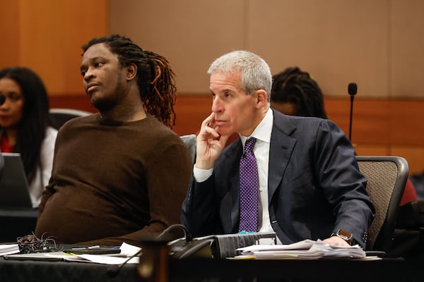 Atlanta rapper Young Thug sits next to his defense attorney Brian Steel during his ongoing gang and racketeering trial at Fulton County Courthouse on Thursday, April 4, 2024. 