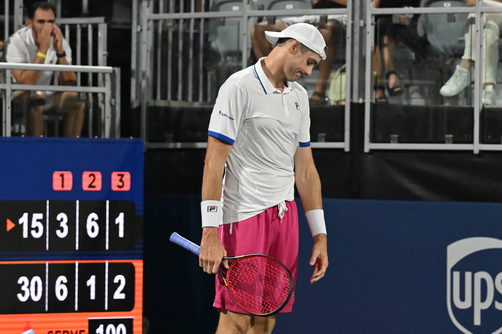 John Isner reacts as he plays against Jenson Brooksby. (Hyosub Shin / Hyosub.Shin@ajc.com)