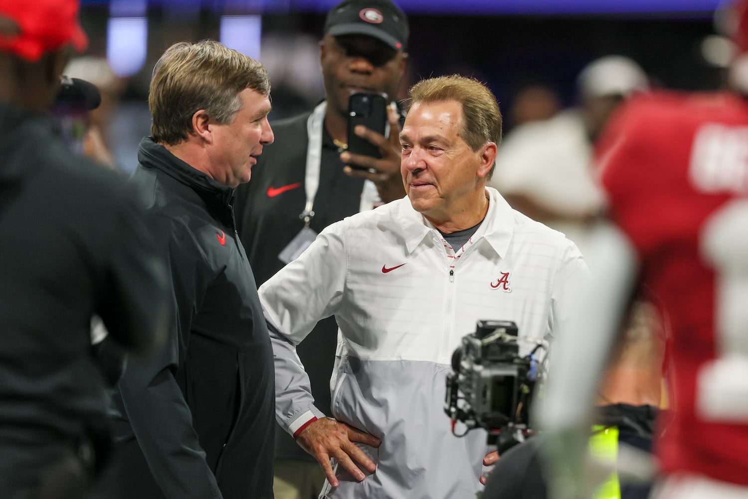 Georgia Bulldogs head coach Kirby Smart and Alabama Crimson Tide head coach Nick Saban get together before the SEC Championship football game at the Mercedes-Benz Stadium in Atlanta, on Saturday, December 2, 2023. (Jason Getz / Jason.Getz@ajc.com)