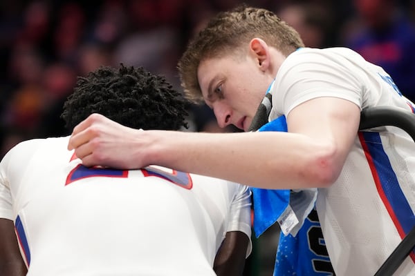 American University's Matt Rogers, right, embraces teammate Eric Michaels during the second half of a First Four college basketball game against Mount St. Mary's in the NCAA Tournament, Tuesday, March 19, 2025, in Dayton, Ohio. (AP Photo/Jeff Dean)