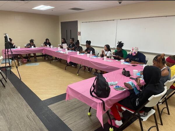 A group from the Girls Dig Deeper Initiative participate in an art therapy session during the Summer in the City Learning Experience. 
(Courtesy of Najiva Timothee)