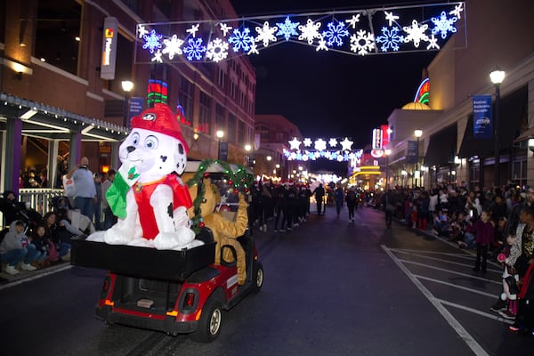 People line 19th Street during the Christmas parade during the Light the Station 2018 holiday event Saturday, November 17, 2018, at Atlantic Station in Atlanta. (Photo: STEVE SCHAEFER / SPECIAL TO THE AJC)