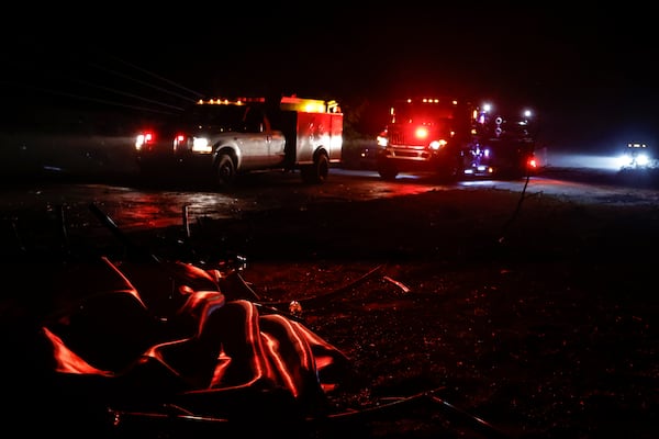 Downed trees and power lines block a road along Highway 82 after a tornado passed through, Sunday, March 16, 2025, in Maplesville, Ala. (AP Photo/Butch Dill)