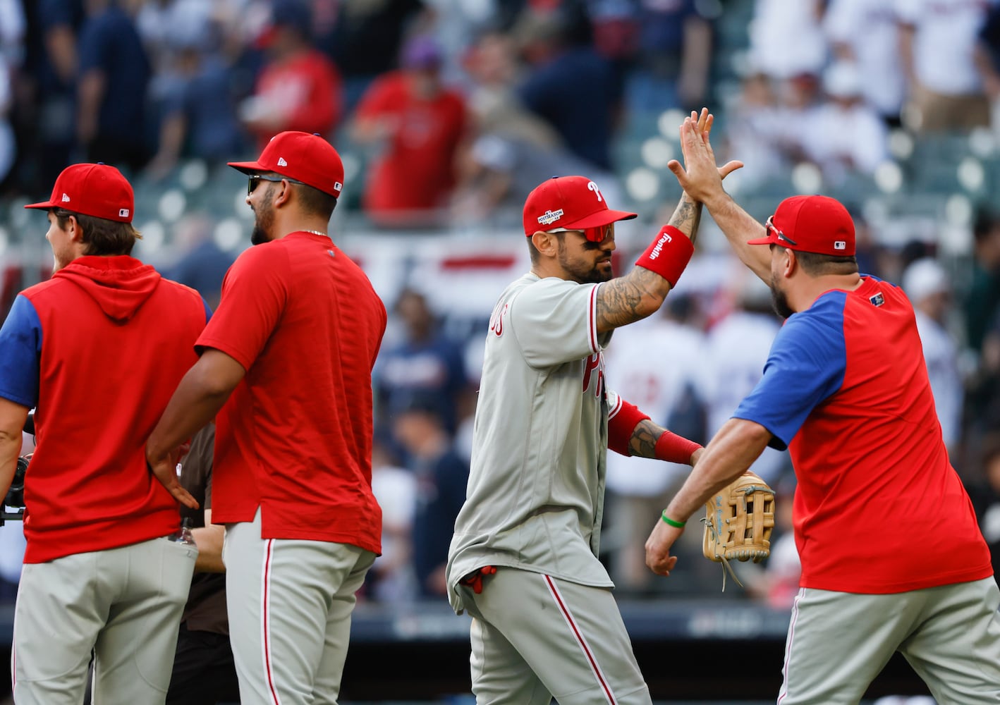 Philadelphia Phillies' Nick Castellanos celebrates with teammates after winning game one of the baseball playoff series between the Braves and the Phillies at Truist Park in Atlanta on Tuesday, October 11, 2022. (Jason Getz / Jason.Getz@ajc.com)