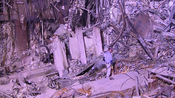 An unidentified worker at Ground Zero stands on a pile of rubble left over from the World Trade Center attacks.