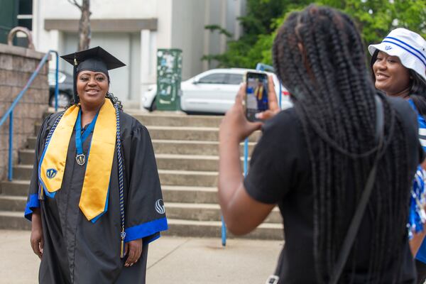 Latonya Young poses for a photo at Georgia State University’s student center in downtown Atlanta, Georgia, on April 29, 2021. Young, a 44-year-old mother of three, will finally graduate from Georgia State University after numerous breaks in her education journey due to hardships. (Rebecca Wright for The Atlanta Journal-Constitution)