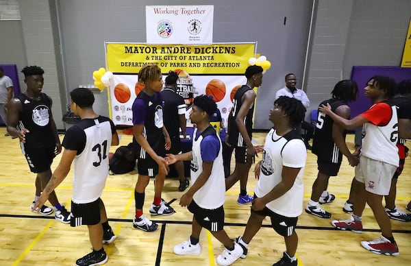 050422 Atlanta: Team members of the Pittman Panthers Black and team 24/7 give each other five after their basketball game during Atlanta Mayor Andre Dickens’ Midnight Basketball League that serves as an anti-crime initiative at the C.T. Martin Recreation Center on Wednesday, May 4, 2022, in Atlanta.    “Curtis Compton / Curtis.Compton@ajc.com”