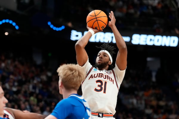 Auburn forward Chaney Johnson (31) shoots the ball during the first half in the second round of the NCAA college basketball tournament, Saturday, March 22, 2025, in Lexington, Ky. (AP Photo/Brynn Anderson)