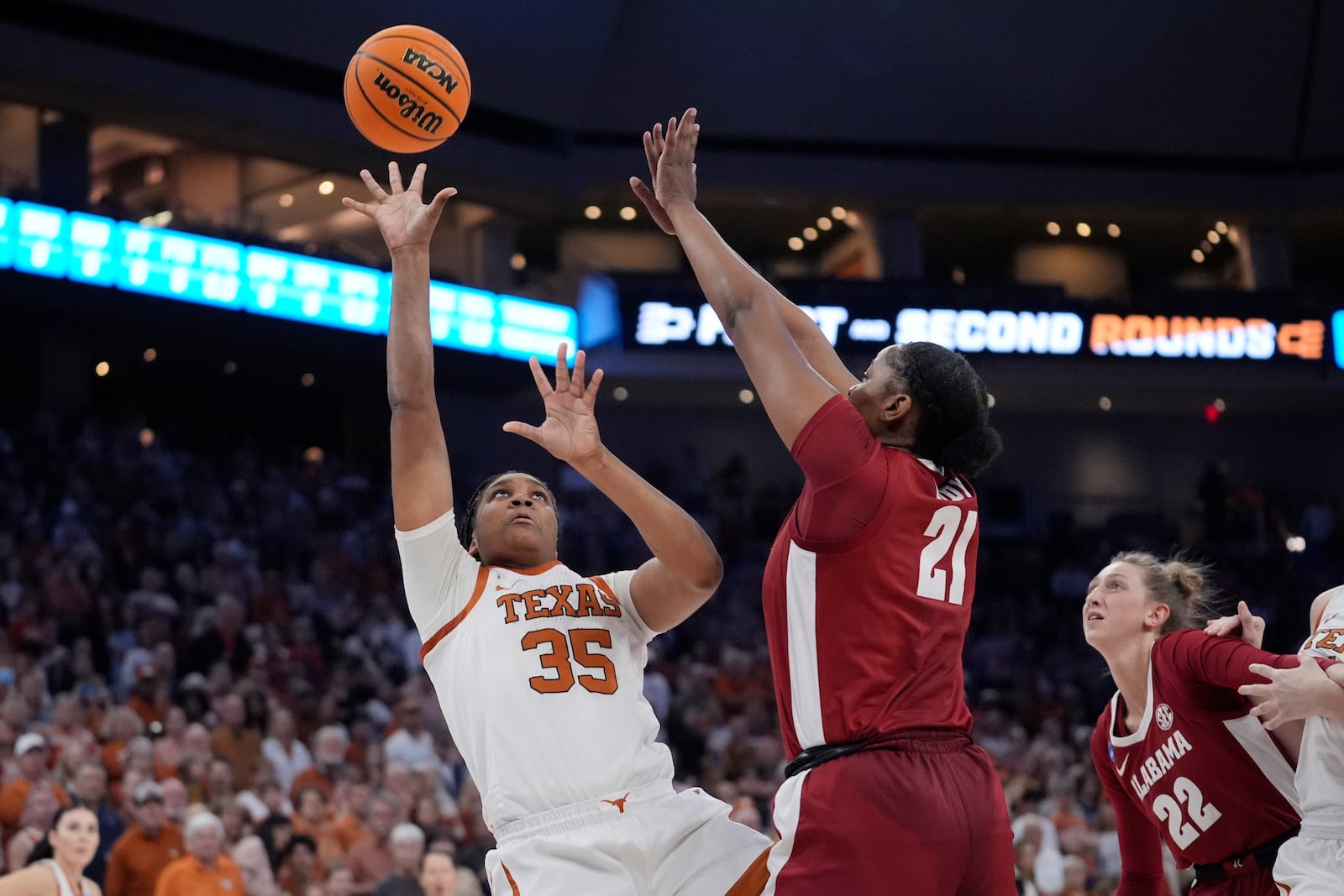 FILE - Texas forward Madison Booker (35) shoots over Alabama forward Essence Cody (21) during the first half of a second-round college basketball game in the women's NCAA Tournament in Austin, Texas, Sunday, March 24, 2024. (AP Photo/Eric Gay, File)