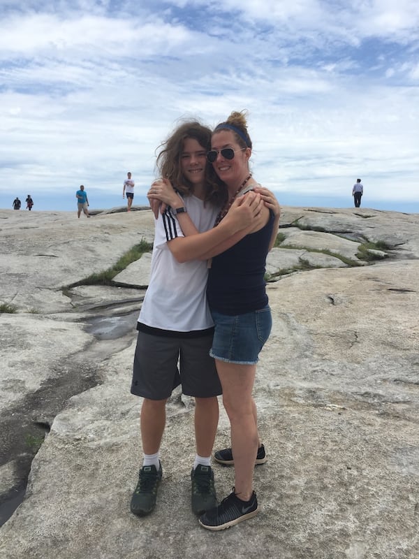 Amy Leavell Bransford and her son Miles Bransford celebrate a healthy hike up Stone Mountain. 
(Courtesy of Amy Leavell Bransford)