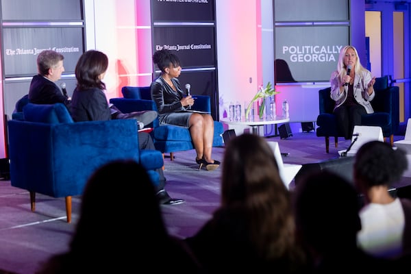 (Left to right): The AJC "Politically Georgia" podcast team of Patricia Murphy, Greg Bluestein and Tia Mitchell interview U.S. Rep. Marjorie Taylor Greene, a Rome Republican, at an event in Washington on Thursday.