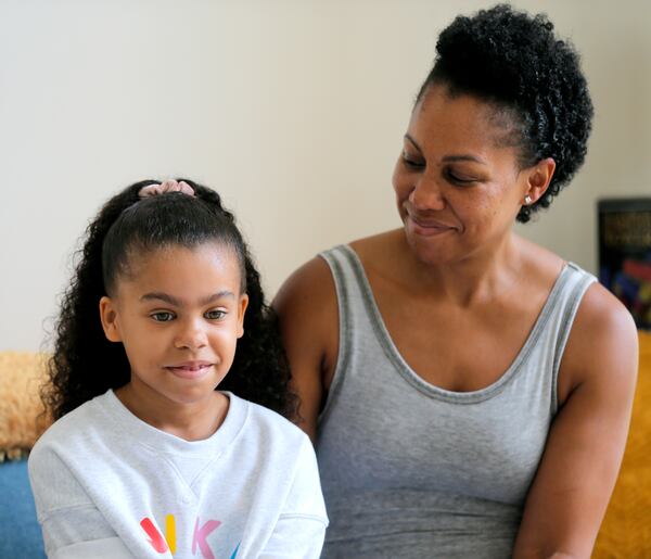 Ayra Murphy, 9, speaks during an interview while her mother April Murphy looks on at her home in Suwanee on Monday, July 12, 2021. Ayra Murphy was placed in a gifted education program two years ago at Sycamore Elementary. (Christine Tannous / christine.tannous@ajc.com)