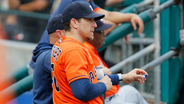 Houston Astros hitting coach Troy Snitker watches from the dugout during the first inning of the second baseball game of a doubleheader against the Detroit Tigers Saturday, June 26, 2021, in Detroit. (Duane Burleson/AP)