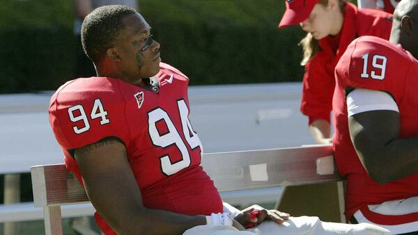 Georgia defensive end Quentin Moses sits quietly on the bench at the end of a UGA loss in 2006. (AJC file photo)