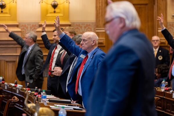 State Sen. Brandon Beach (center), R-Alpharetta, and other senators vote on a measure which would support increased protections for America’s borders, at the Capitol in Atlanta on Feb. 12, 2024. (Arvin Temkar / arvin.temkar@ajc.com)