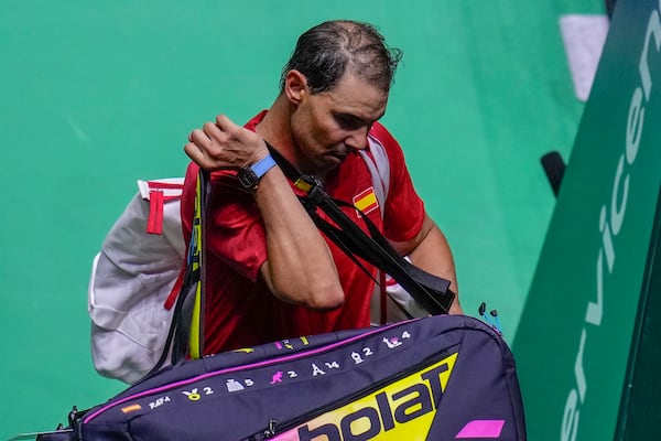 Spain's tennis player Rafael Nadal leaves the court after losing against Netherlands' Botic Van De Zandschulp during a Davis Cup quarterfinal match at Martin Carpena Sports Hall in Malaga, southern Spain, on Tuesday, Nov. 19, 2024. (AP Photo/Manu Fernandez)