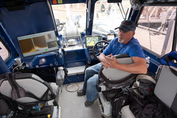 Keith Cormican, founder of Bruce’s Legacy, a volunteer organization that provides search and recovery operations for drowned victims, sits aboard his boat while taking a break from searching for the body of Gary Jones in Lake Oconee northeast of Eatonton on Saturday, March 8, 2025.   Ben Gray for the Atlanta Journal-Constitution