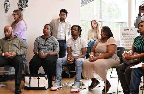 Workshop participants including Kevaughn Hickman (center) and Katrina Butler (right) listen to Atlanta Hawks guard Trent Forrest (not pictured) during educational workshops to enhance their financial health and understanding of business finances at Summerhill Chase Community Center Branch, Tuesday, March 26, 2024, in Atlanta. The Atlanta Hawks and Chase are launching a new community program for aspiring entrepreneurs who have left.the justice system. (Hyosub Shin / Hyosub.Shin@ajc.com)