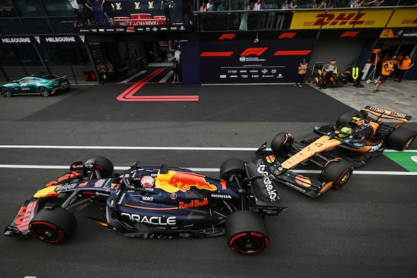 McLaren driver Lando Norris of Britain follows Red Bull driver Max Verstappen of the Netherlands down pit lane during qualifying at the Australian Formula One Grand Prix at Albert Park, in Melbourne, Australia, Saturday, March 15, 2025. (Tracey Nearmy/Pool Photo via AP)