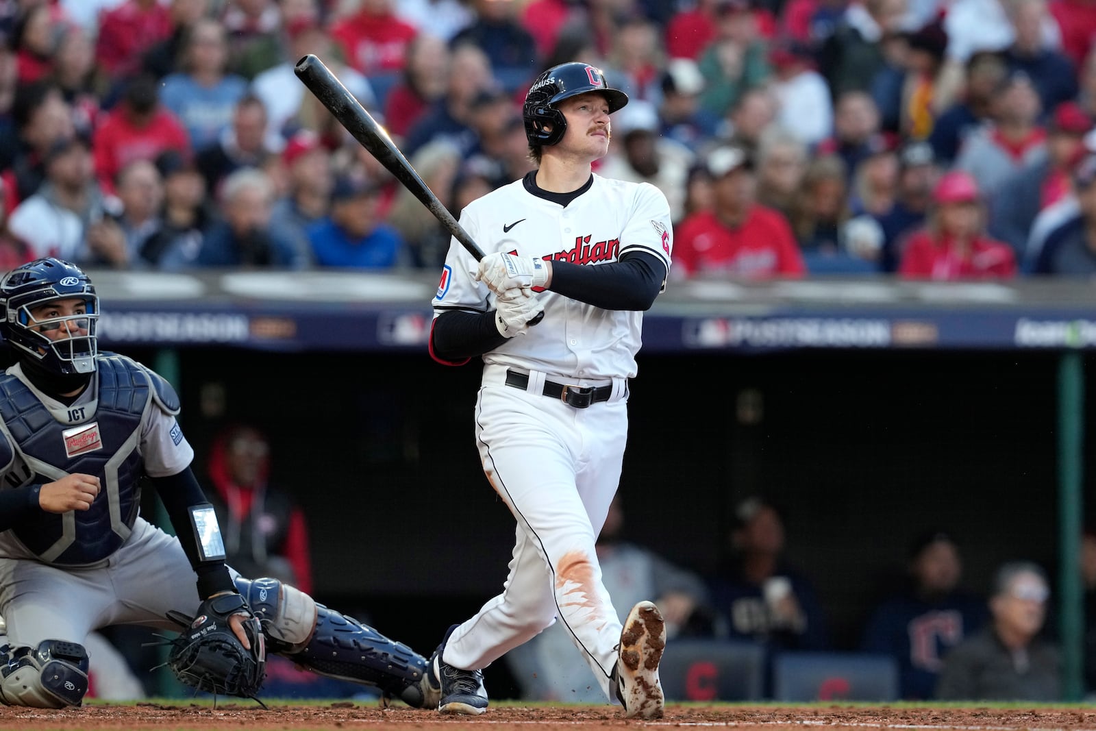 Cleveland Guardians' Kyle Manzardo, right, watches his two-run home run along with New York Yankees catcher Jose Trevino during the third inning in Game 3 of the baseball AL Championship Series Thursday, Oct. 17, 2024, in Cleveland.(AP Photo/Godofredo Vásquez )