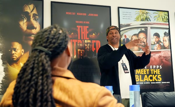 Filmmaker and former professional basketball player Deon Taylor, right, discusses the movie industry with NFL player Trayvon Henderson during a filmmaking workshop for NFL players on Tuesday, March 4, 2025, in Santa Monica, Calif. (AP Photo/Chris Pizzello)