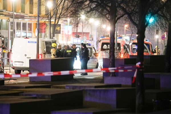 Emergency services attend the scene at the Holocaust memorial after a man was attacked at the memorial site in Berlin, Germany, Friday, Feb. 21, 2025. (AP Photo/Ebrahim Noroozi)