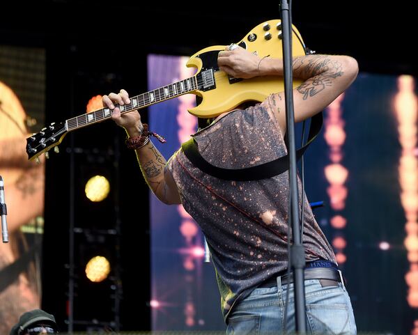 Frontman Joseph Arthur of the band Arthur Buck gets creative on the Great Southeast Music Hall Stage at Music Midtown on Saturday, Sept. 15, 2018. The two-day music festival includes Imagine Dragons, Kendrick Lamar and Post Malone. (Photo: RYON HORNE/RHORNE@AJC.COM)