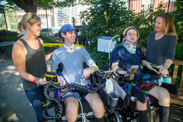 (left to right) Kristen O'Brien, her son Britt, Julian Stanford & his mother Jennifer chat in The Shepherd Center secret garden. The two mothers met at the center where their boys are patients. Both boys are currently paralyzed due to recent accidents. Due to COVID, the situation has been made extra difficult- no guests, only one parent, etc. The two women met in the halls and have formed an unlikely friendship in the midst of the unfathomable. PHIL SKINNER FOR THE ATLANTA JOURNAL-CONSTITUTION.