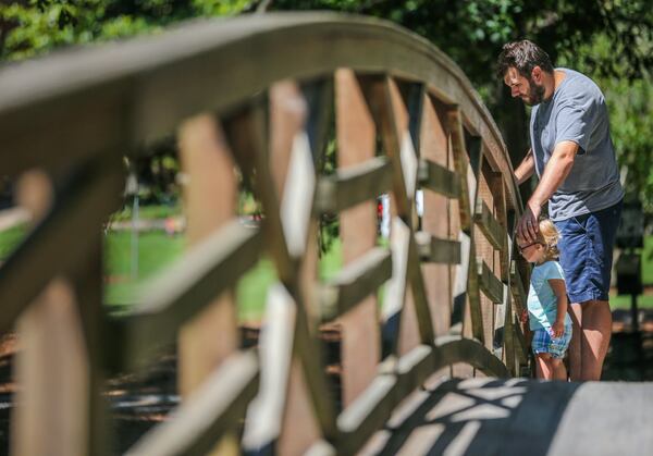 In this 2017 file photo, Josh Williams brings his daughter Ava to Lake Avondale in Avondale Estates. JOHN SPINK/JSPINK@AJC.COM.